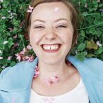 Headshot of a smiling wellness coach.